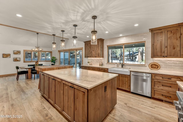 116 Cypress Way, Stateline, NV 89449 - kitchen featuring stainless steel dishwasher, a center island, backsplash, brown cabinetry, and recessed lighting