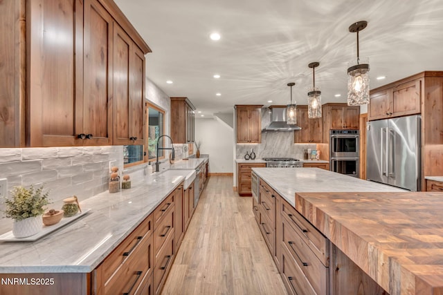 116 Cypress Way, Stateline, NV 89449 - kitchen featuring stainless steel appliances, wall chimney exhaust hood, butcher block countertops, recessed lighting, and light wood-style floors