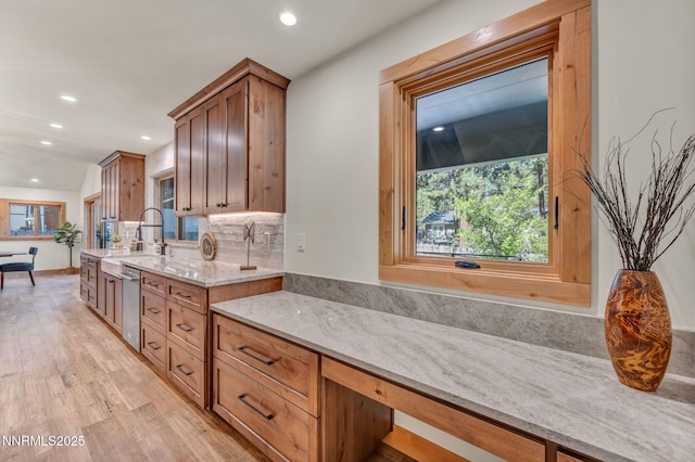 116 Cypress Way, Stateline, NV 89449 - kitchen with light stone countertops, light wood finished floors, recessed lighting, dishwasher, and plenty of natural light