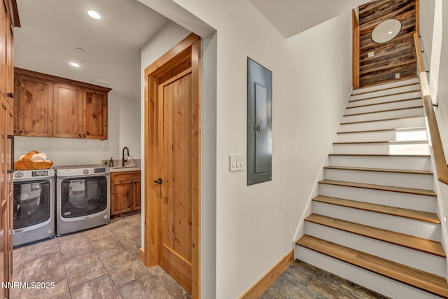 116 Cypress Way, Stateline, NV 89449 - laundry room featuring cabinet space, washing machine and dryer, stone finish floors, recessed lighting, and electric panel
