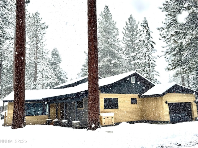 116 Cypress Way, Stateline, NV 89449 - snow covered property with a garage
