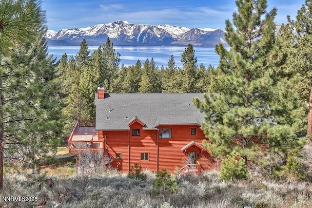 606 Jerry Dr, Zephyr Cove, NV 89448 - back of house featuring stairs, a chimney, and a deck with mountain view