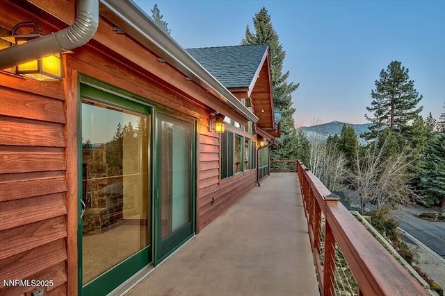 606 Jerry Dr, Zephyr Cove, NV 89448 - view of side of property featuring roof with shingles, a mountain view, and a balcony