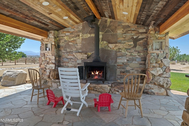 1725 Grandview Pkwy, Minden, NV 89423 - view of patio featuring a warm lit fireplace and a mountain view