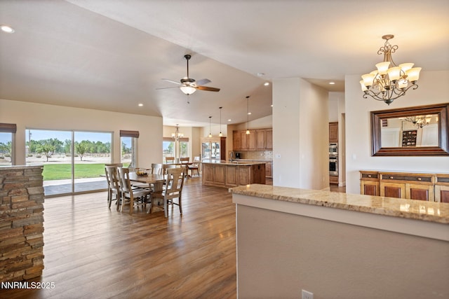 1725 Grandview Pkwy, Minden, NV 89423 - dining space with a chandelier, dark wood-type flooring, a ceiling fan, recessed lighting, and vaulted ceiling