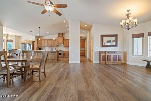 1725 Grandview Pkwy, Minden, NV 89423 - dining room with a chandelier, lofted ceiling, wood finished floors, ceiling fan, and recessed lighting