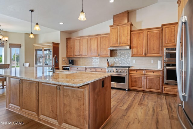 1725 Grandview Pkwy, Minden, NV 89423 - kitchen featuring appliances with stainless steel finishes, vaulted ceiling, backsplash, dark wood finished floors, and recessed lighting