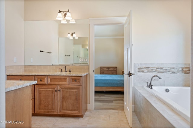 1725 Grandview Pkwy, Minden, NV 89423 - bathroom featuring vanity, a bath, ornamental molding, tile patterned floors, and backsplash