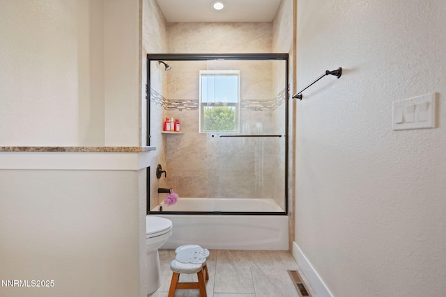 1725 Grandview Pkwy, Minden, NV 89423 - bathroom with combined bath / shower with glass door, tile patterned flooring, and a textured wall