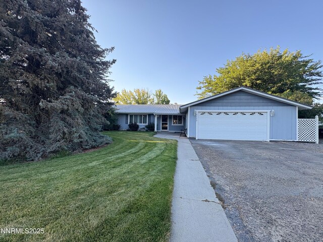 5045 Offenhauser Dr, Winnemucca, NV 89445 - single story home featuring an attached garage, driveway, and a front yard