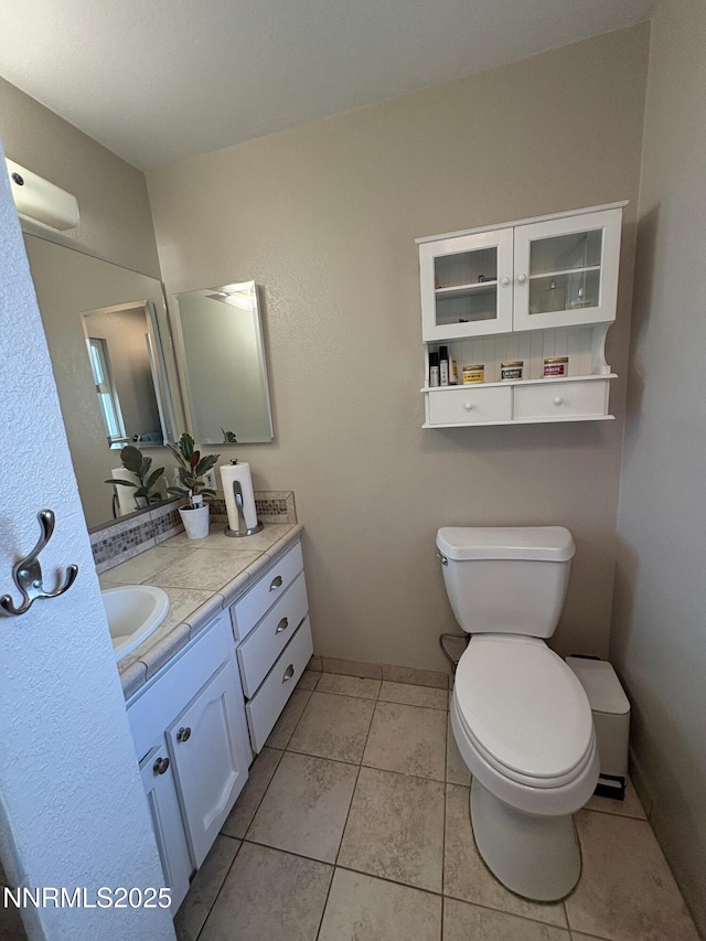 5045 Offenhauser Dr, Winnemucca, NV 89445 - half bath with vanity and tile patterned floors