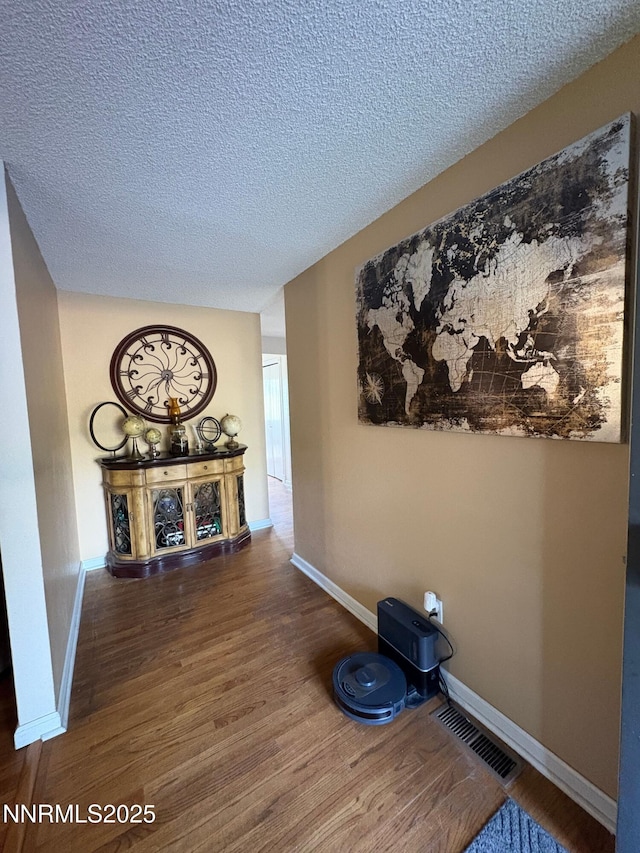 5045 Offenhauser Dr, Winnemucca, NV 89445 - hall with wood finished floors and a textured ceiling