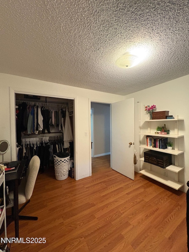 5045 Offenhauser Dr, Winnemucca, NV 89445 - home office featuring a textured ceiling and wood finished floors
