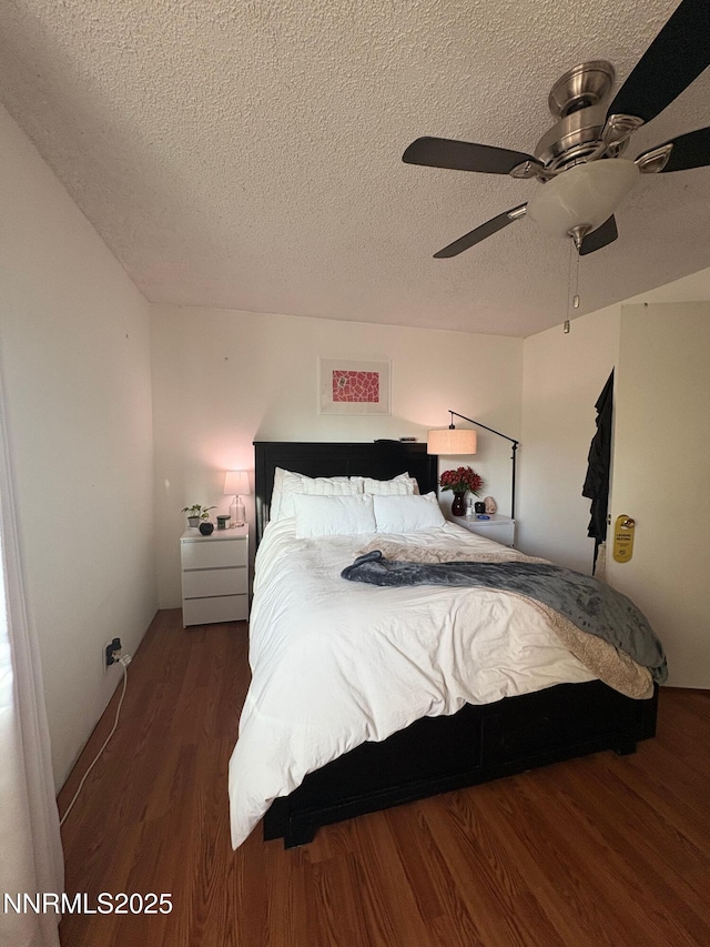 5045 Offenhauser Dr, Winnemucca, NV 89445 - bedroom with wood finished floors, a textured ceiling, and ceiling fan
