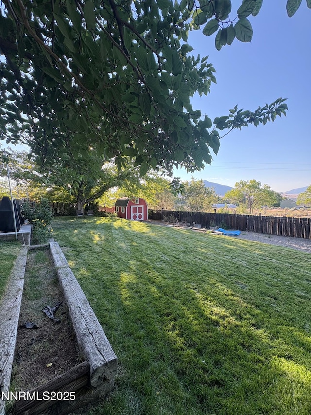 5045 Offenhauser Dr, Winnemucca, NV 89445 - fenced backyard with a storage unit