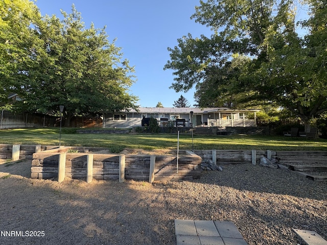 5045 Offenhauser Dr, Winnemucca, NV 89445 - view of front of house with a front yard and a wooden deck