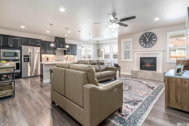 1230 W Cottage Loop, Gardnerville, NV 89460 - living room featuring ceiling fan, wood finished floors, beverage cooler, recessed lighting, and a fireplace
