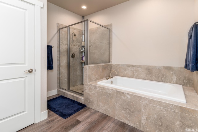 1230 W Cottage Loop, Gardnerville, NV 89460 - bathroom with a bath, a shower stall, and wood finished floors