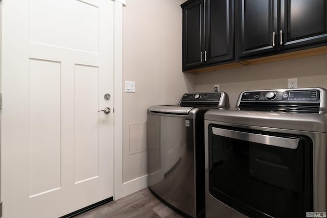 1230 W Cottage Loop, Gardnerville, NV 89460 - laundry area with separate washer and dryer, cabinet space, and wood finished floors