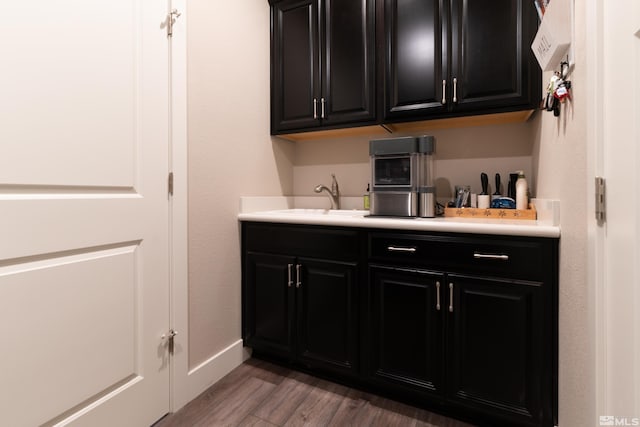 1230 W Cottage Loop, Gardnerville, NV 89460 - laundry area with light wood-style flooring and baseboards