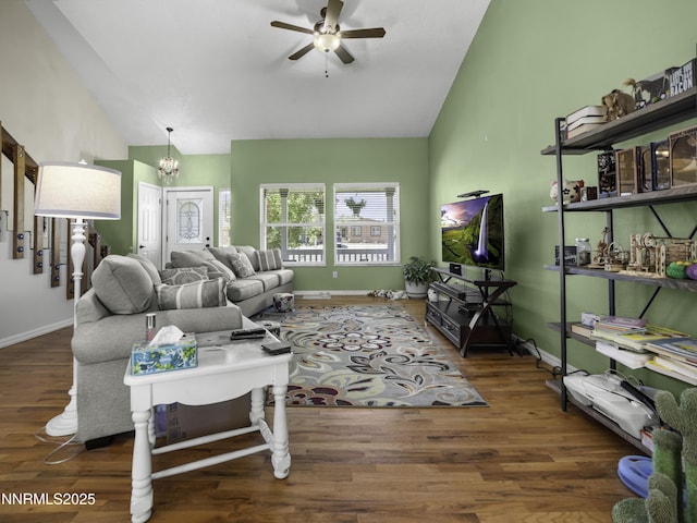 1755 Mizpah St, Winnemucca, NV 89445 - living area featuring lofted ceiling, a ceiling fan, a chandelier, and wood finished floors