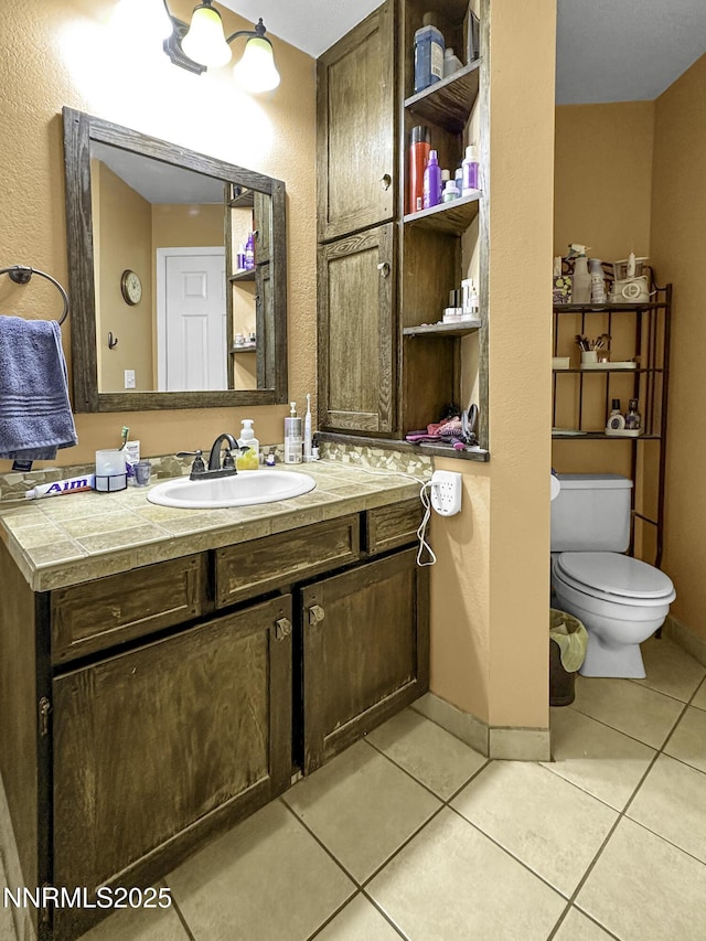 1755 Mizpah St, Winnemucca, NV 89445 - bathroom with tile patterned flooring and vanity