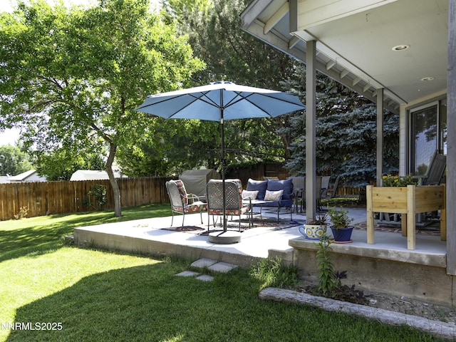 1755 Mizpah St, Winnemucca, NV 89445 - fenced backyard with a patio area and an outdoor living space