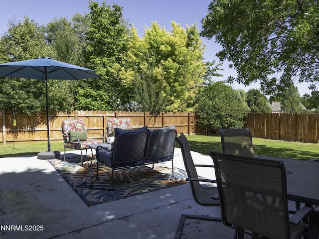 1755 Mizpah St, Winnemucca, NV 89445 - fenced backyard featuring a patio and an outdoor living space