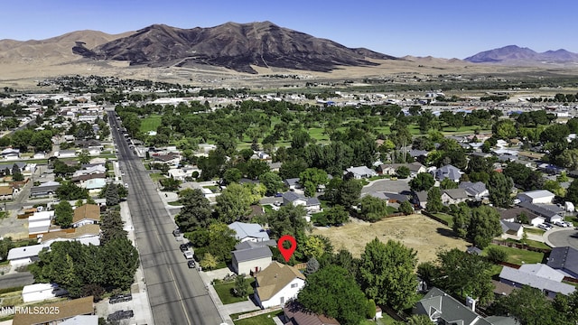 1755 Mizpah St, Winnemucca, NV 89445 - aerial view of property and surrounding area featuring mountains and nearby suburban area