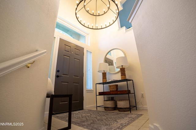 2691 Sutter Butte Ct, Sparks, NV 89436 - foyer entrance featuring a chandelier, light tile patterned flooring, and a textured wall
