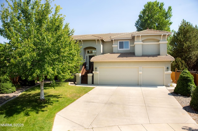 2691 Sutter Butte Ct, Sparks, NV 89436 - view of front facade with an attached garage, a tiled roof, stucco siding, and concrete driveway