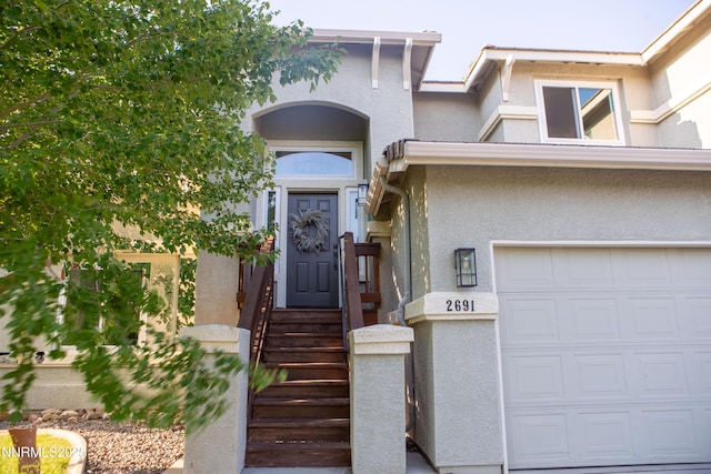 2691 Sutter Butte Ct, Sparks, NV 89436 - view of exterior entry with stucco siding and a garage