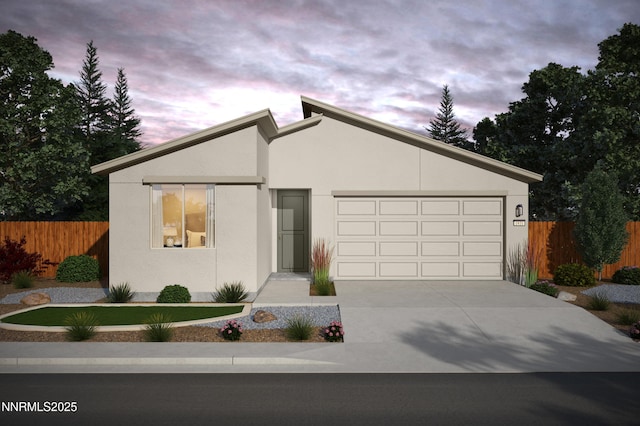 570 E Patrician Dr Lot 1, Reno, NV 89506 - view of front of house featuring stucco siding, an attached garage, and concrete driveway
