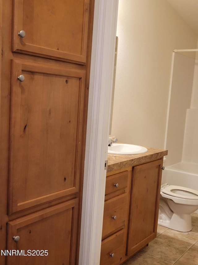 3340 Moon Ln, Winnemucca, NV 89445 - full bathroom with vanity, tile patterned floors, and washtub / shower combination