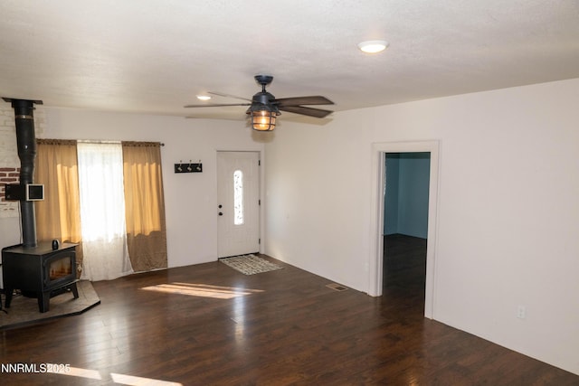 406 W 5th St, Winnemucca, NV 89445 - entryway featuring a wood stove, wood finished floors, and a ceiling fan