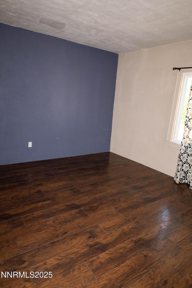 406 W 5th St, Winnemucca, NV 89445 - spare room featuring dark wood-style flooring