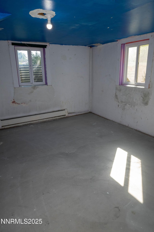 406 W 5th St, Winnemucca, NV 89445 - empty room with a baseboard radiator and concrete flooring
