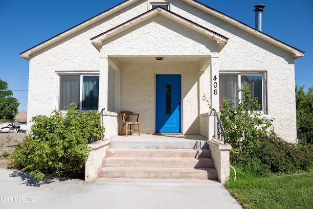 406 W 5th St, Winnemucca, NV 89445 - doorway to property with stucco siding
