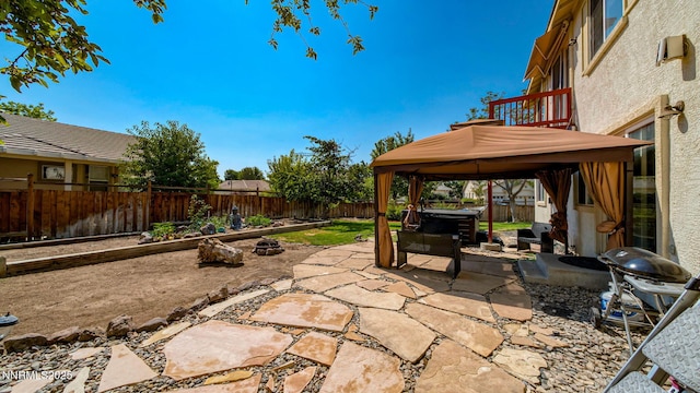 7302 Little Easy St, Sparks, NV 89436 - fenced backyard with a gazebo, a patio area, a hot tub, and area for grilling