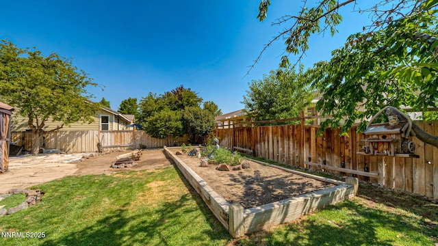7302 Little Easy St, Sparks, NV 89436 - fenced backyard with a vegetable garden