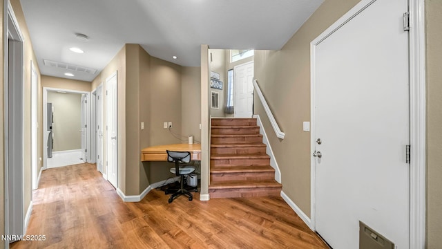 7302 Little Easy St, Sparks, NV 89436 - foyer entrance with light wood-style floors, recessed lighting, and stairway