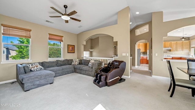 7302 Little Easy St, Sparks, NV 89436 - living room featuring a ceiling fan, arched walkways, light carpet, and vaulted ceiling