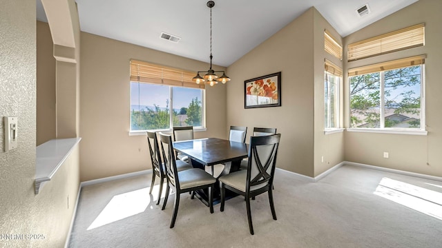 7302 Little Easy St, Sparks, NV 89436 - dining area featuring vaulted ceiling, a chandelier, plenty of natural light, and light colored carpet