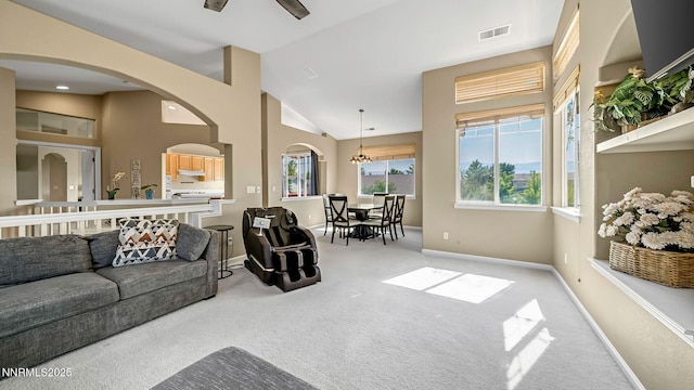 7302 Little Easy St, Sparks, NV 89436 - carpeted living room featuring lofted ceiling, a ceiling fan, and arched walkways