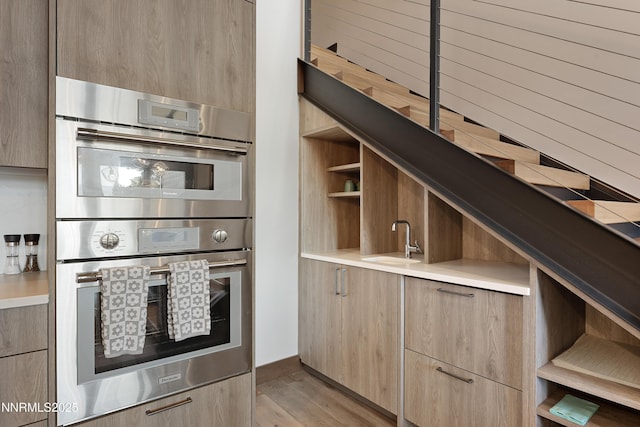 17 Beach Club Dr Unit 214, Stateline, NV 89449 - kitchen featuring stainless steel double oven, modern cabinets, open shelves, and light brown cabinetry