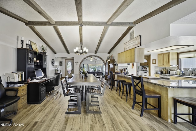 202 Summit Ave, Winnemucca, NV 89445 - dining area featuring a chandelier, high vaulted ceiling, light wood-type flooring, beamed ceiling, and healthy amount of natural light
