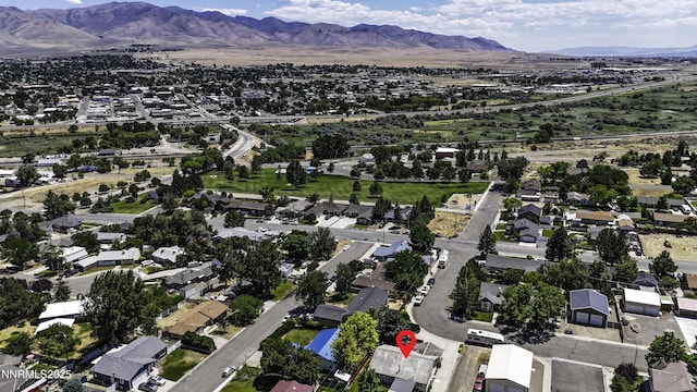 202 Summit Ave, Winnemucca, NV 89445 - aerial overview of property's location with a mountainous background and nearby suburban area