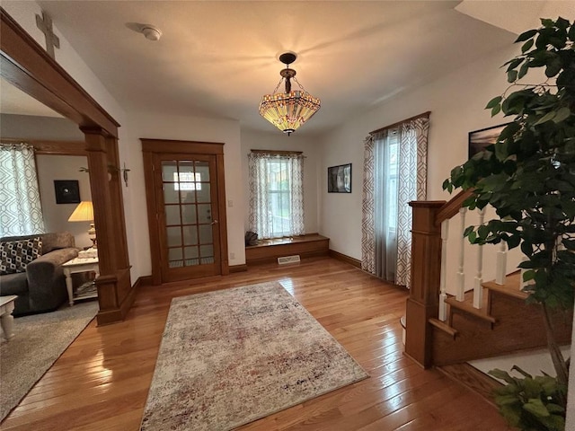 563 W 9th St, Erie, PA 16502 - entrance foyer with light wood-style flooring and stairs