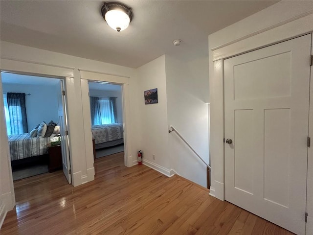563 W 9th St, Erie, PA 16502 - hallway with an upstairs landing and light wood-style flooring