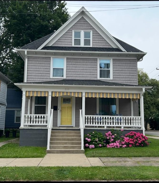 563 W 9th St, Erie, PA 16502 - american foursquare style home with a porch and roof with shingles